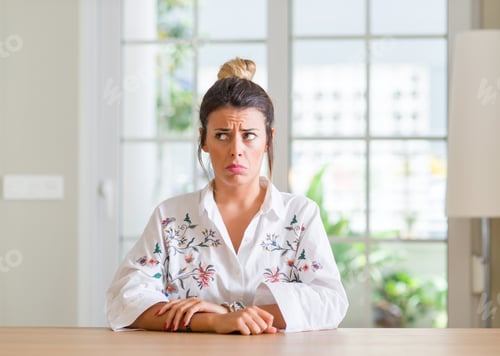 Preview: Young Woman At Home Skeptic And Nervous, Frowning Upset Because Of Problem. Negative Person.