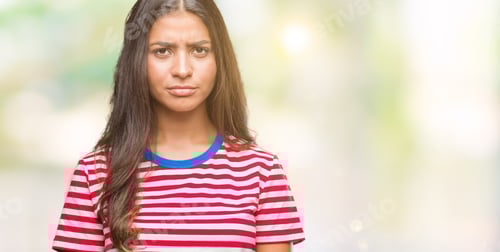 Preview: Young Beautiful Arab Woman Over Isolated Background Skeptic And Nervous, Frowning Upset Because Of