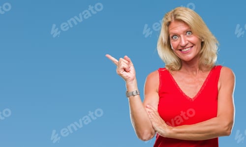 Preview: Middle Age Blonde Woman Over Isolated Background With A Big Smile On Face, Pointing With Hand And