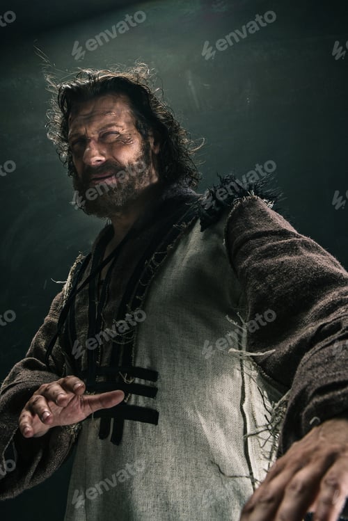 Preview: Portrait Of A Brutal Bald-Headed Viking In A Battle Mail Posing Against A Black Background.