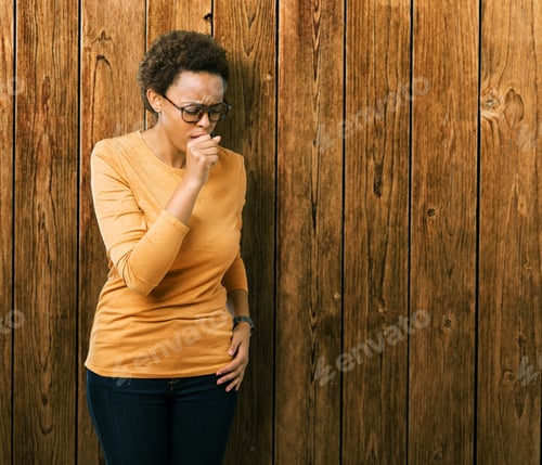 Preview: Young Beautiful African American Woman Wearing Glasses Over Isolated Background Feeling Unwell And