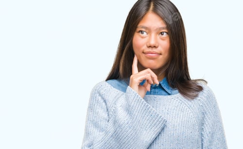 Preview: Young Asian Woman Wearing Winter Sweater Over Isolated Background With Hand On Chin Thinking About