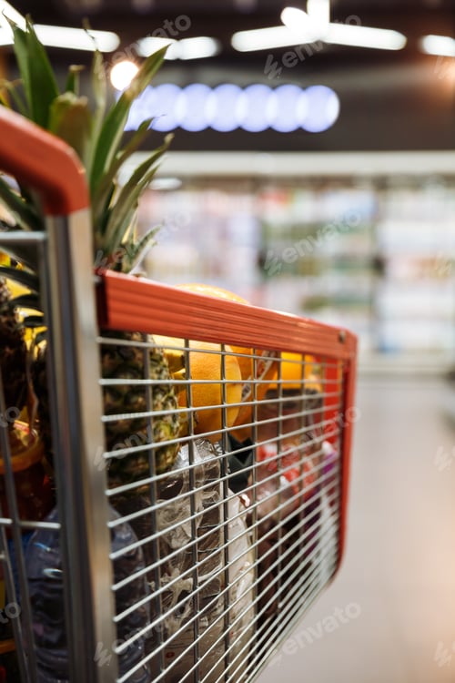 Preview: Image Of A Lot Of Fruits In Shopping Trolley In Supermarket.