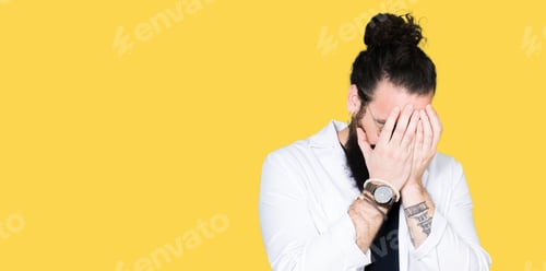 Preview: Doctor Therapist Man With Long Hair And Bear Wearing White Coat With Sad Expression Covering Face