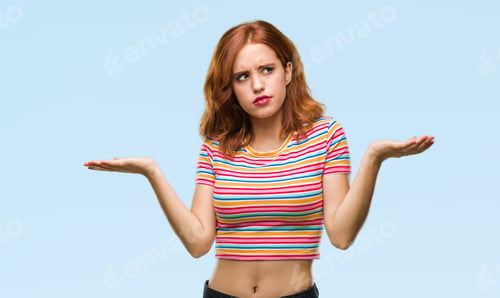 Preview: Young Beautiful Woman Over Isolated Background Clueless And Confused Expression With Arms And Hands