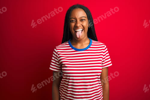 Preview: Young African American Woman Wearing Striped T-Shirt Standing Over Isolated Red Background Sticking