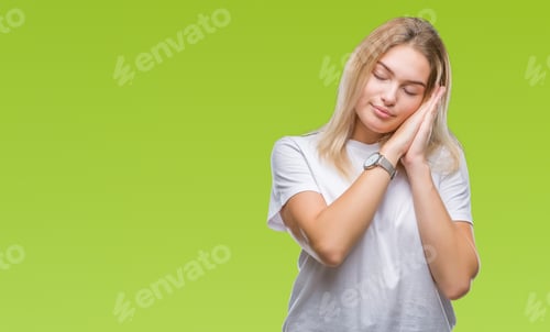 Preview: Young Caucasian Woman Over Isolated Background Sleeping Tired Dreaming And Posing With Hands