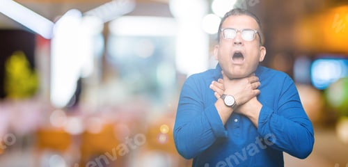 Preview: Middle Age Arab Man Wearing Glasses Over Isolated Background Shouting And Suffocate Because Painful