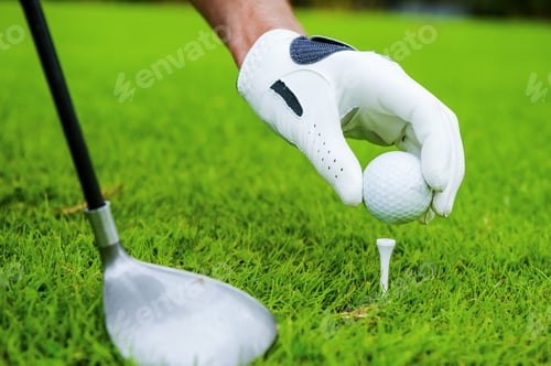 Preview: Preparing For Strike. Close-Up Of Golfer Setting A Ball To Strike