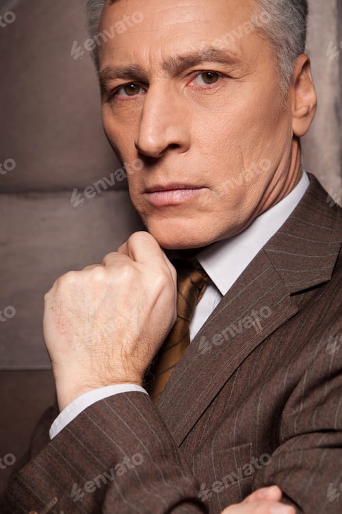Preview: Portrait Of Confidence. Side View Of Confident Senior Man In Formalwear Holding Hand On Chin And
