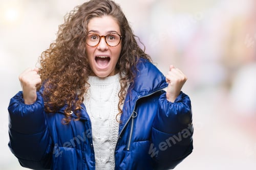 Preview: Beautiful Young Brunette Curly Hair Girl Wearing Winter Coat, Glasses And Sweater Over Isolated