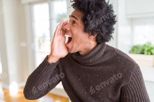 Preview: African American Man Wearing Winter Sweater Shouting And Screaming Loud To Side With Hand On Mouth