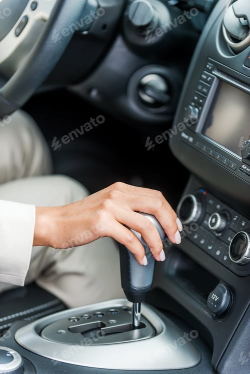 Preview: Driving A Car. Close-Up Of Woman In Formalwear Driving Car