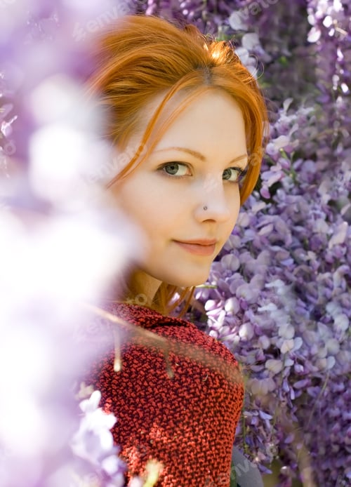 Preview: Romantic Portrait Of Beautiful Young Redhead Girl Among Spring Lilac Flowers.