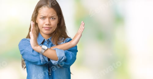 Preview: Young Beautiful Brunette Woman Wearing Blue Denim Shirt Over Isolated Background Rejection