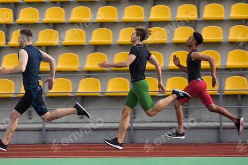 Preview: Photo Of Young Multiethnic Athlete Group Run On Running Track Outdoors. Looking Aside.