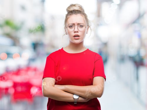 Preview: Young Blonde Woman Wearing Glasses Over Isolated Background Skeptic And Nervous, Disapproving
