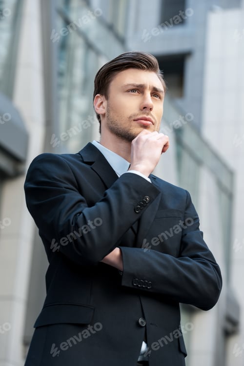 Preview: In Search Of Inspiration. Side View Of Thoughtful Young Man In Formalwear Looking Away And Holding