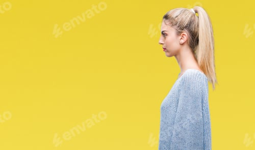 Preview: Woman in Profile Poses Against Yellow Background