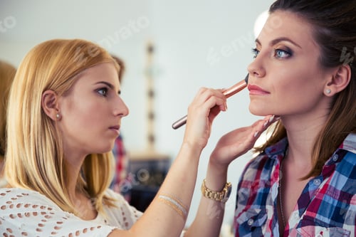 Preview: Makeup Woman Applying Makeup To Model In Salon