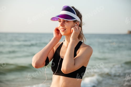 Preview: Runner Girl Wearing Earphones And Running Armband Phone Arm Strap Getting Ready For Run Workout