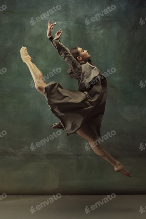 Preview: In Flight. Graceful Classic Ballerina Dancing, Posing Isolated On Dark Studio Background. Stylish
