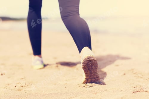 Preview: Woman Jogging On The Beach