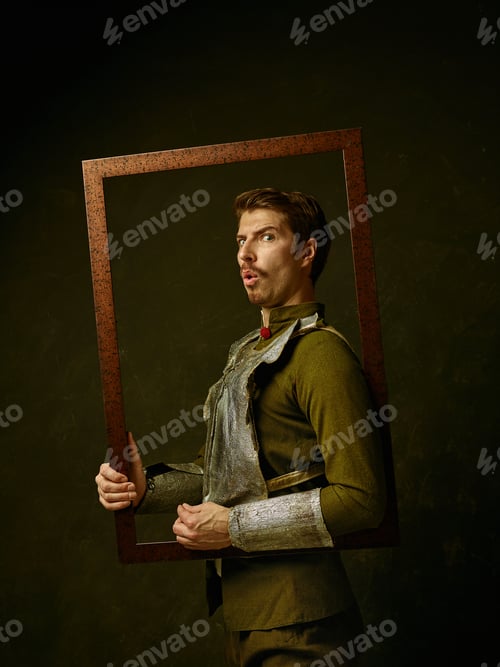 Preview: Medieval Knight On Dark Studio Background. Portrait In Low Key Of Brutal Man In Tradishional Retro