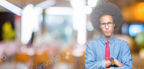 Preview: Young African American Business Man With Afro Hair Wearing Glasses And Red Tie Skeptic And Nervous