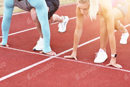 Preview: Man And Woman Racing On Outdoor Track