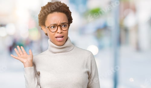 Preview: Young Beautiful African American Woman Wearing Glasses Over Isolated Background In Shock Face
