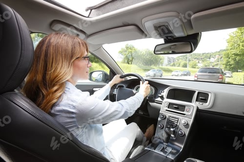 Preview: Portrait Of Middle Aged Woman Driving A Car.
