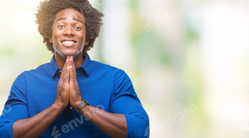 Preview: Afro American Man Over Isolated Background Praying With Hands Together Asking For Forgiveness