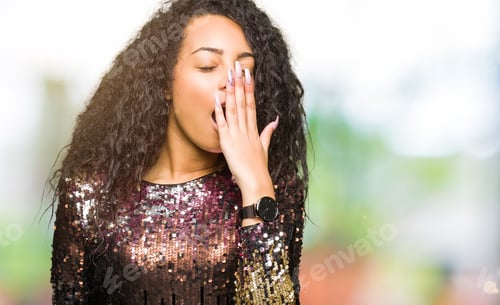 Preview: Young Beautiful Girl With Curly Hair Wearing Night Party Dress Bored Yawning Tired Covering Mouth