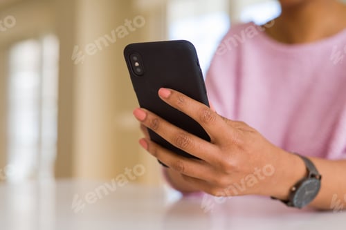 Preview: Close Up Of African American Woman Using Smartphone And Smiling