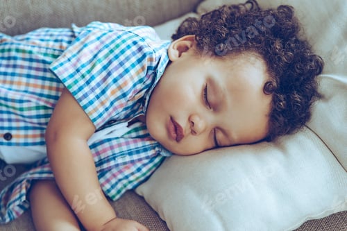 Preview: Sweet Dreams. Little African Baby Boy Sleeping While Lying On Couch At Home