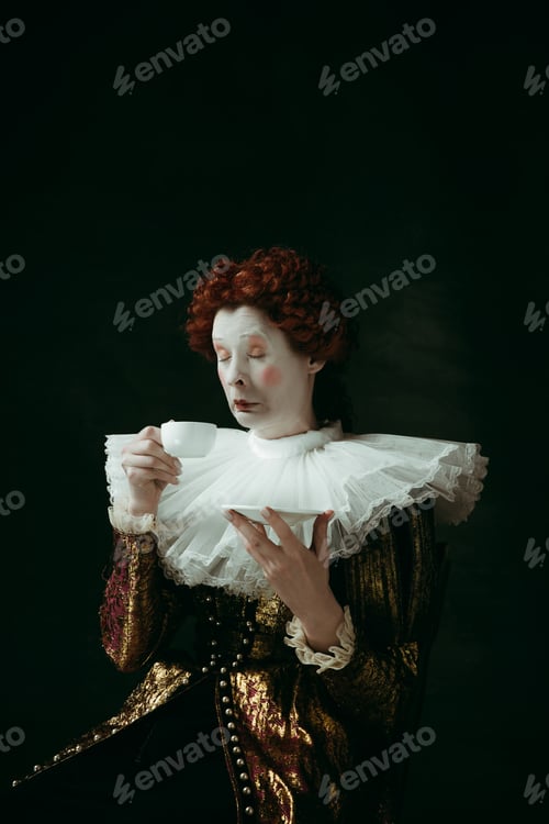 Preview: Too Hot And Strong. Medieval Redhead Young Woman In Golden Vintage Clothing As A Duchess Drinking A
