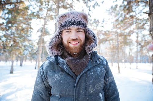 Preview: Smiling Handsome Man In Winter Cloth Standing Outdoors And Looking At Camera