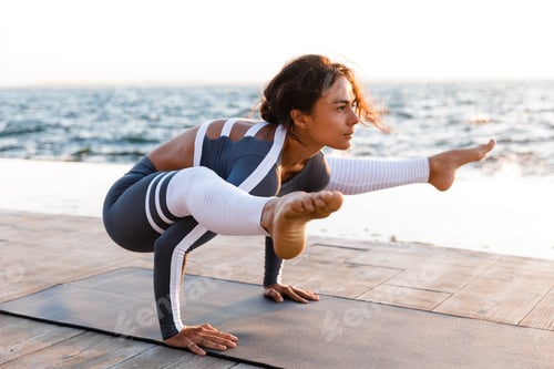 Preview: Picture Of Young Fitness Lady Outdoors In The Beach Make Yoga Stretching Exercises.