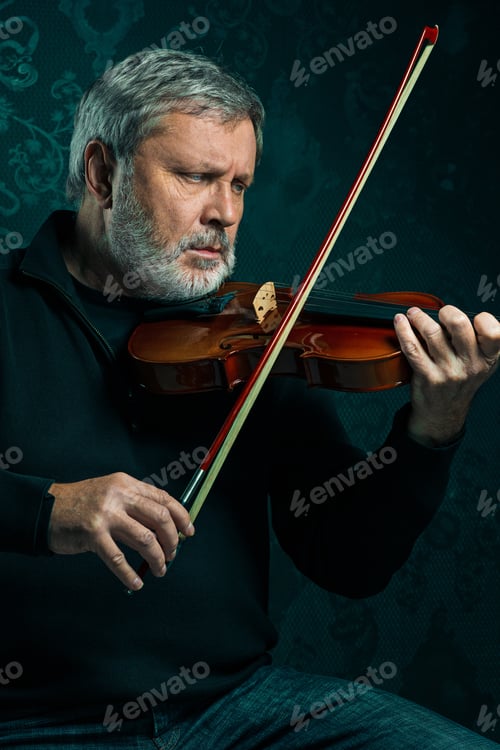 Preview: Senior Musician Playing A Violin With Wand On Black Background