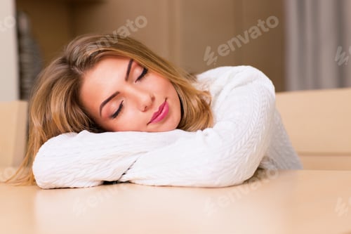 Preview: Young Woman Sleeping At The Table