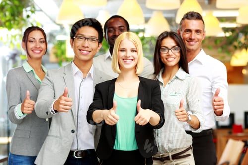Preview: Smiling Business Group Giving Thumbs Up