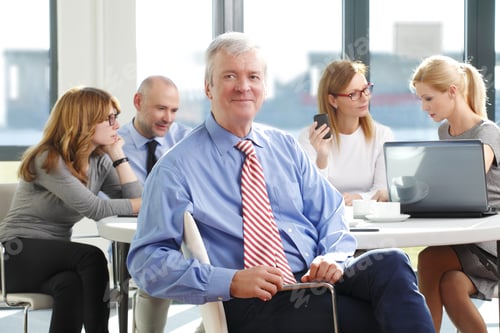 Preview: Image Of Executive Manager Sitting At Business Meeting While Business People Consulting At