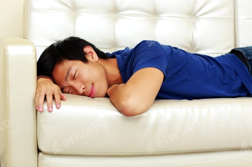Preview: Portrait Of Asian Man Sleeping On The Sofa