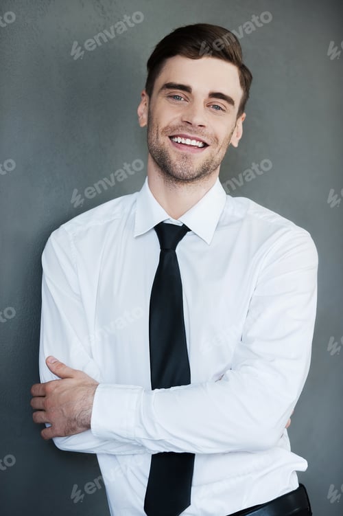 Preview: Happy Businessman. Cheerful Young Businessman Looking At Camera And Keeping Arms Crossed While