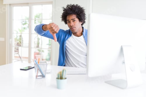 Preview: African American Man Working Using Computer With Angry Face, Negative Sign Showing Dislike With
