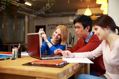 Preview: Happy Students Doing Homework With Laptop Together