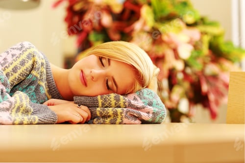 Preview: Portrait Of A Young Sleeping Woman On The Table At Home