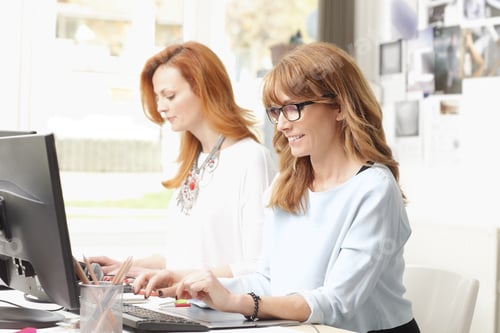 Preview: Modern Graphic Designer Woman Working With Colleagues In Office. Small Business.