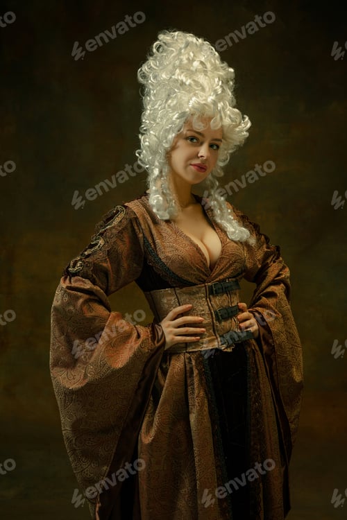 Preview: Portrait Of Medieval Young Woman In Brown Vintage Clothing Standing On Dark Background. Female